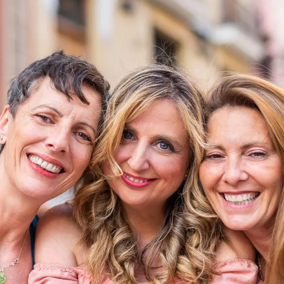 Three smiling women together