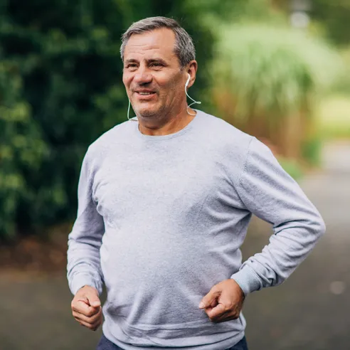 Smiling middle-aged man outdoors