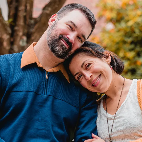 Smiling couple embracing outdoors
