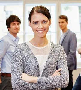 Smiling woman with colleagues in an office